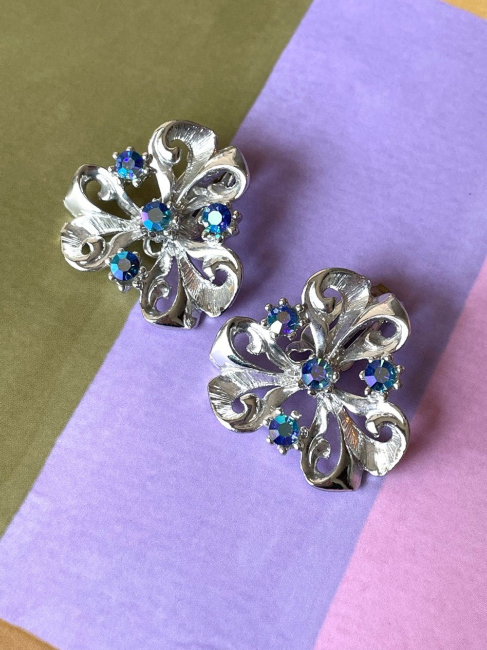Vintage silvertone flourish & blue AB crystal clip-on earrings